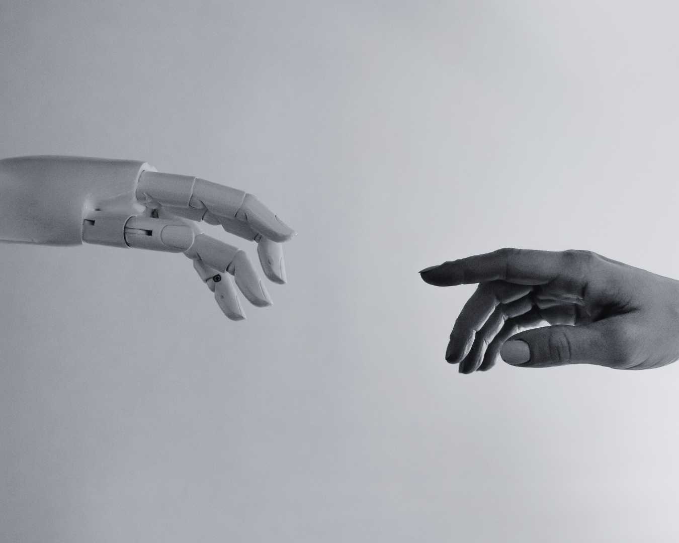 robot hand and human hand touching